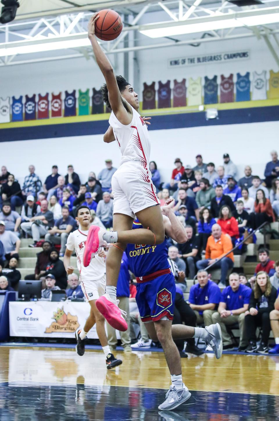 Newport's Taylen Kinney (0) goes up for two of his 13 points in the first half against Washington County at Wednesday's 2023 King of the Bluegrass basketball tournament at Fairdale High School. Dec. 20, 2023