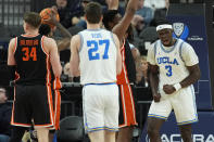 UCLA forward Adem Bona (3) celebrates after a play against Oregon State during the second half of an NCAA college basketball game in the first round of the Pac-12 tournament Wednesday, March 13, 2024, in Las Vegas. (AP Photo/John Locher)