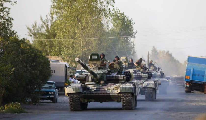 A column of the Azerbaijani tanks moves toward the front line of renewed fighting with Armenian forces in Nagorno-Karabakh on Aug. 2.