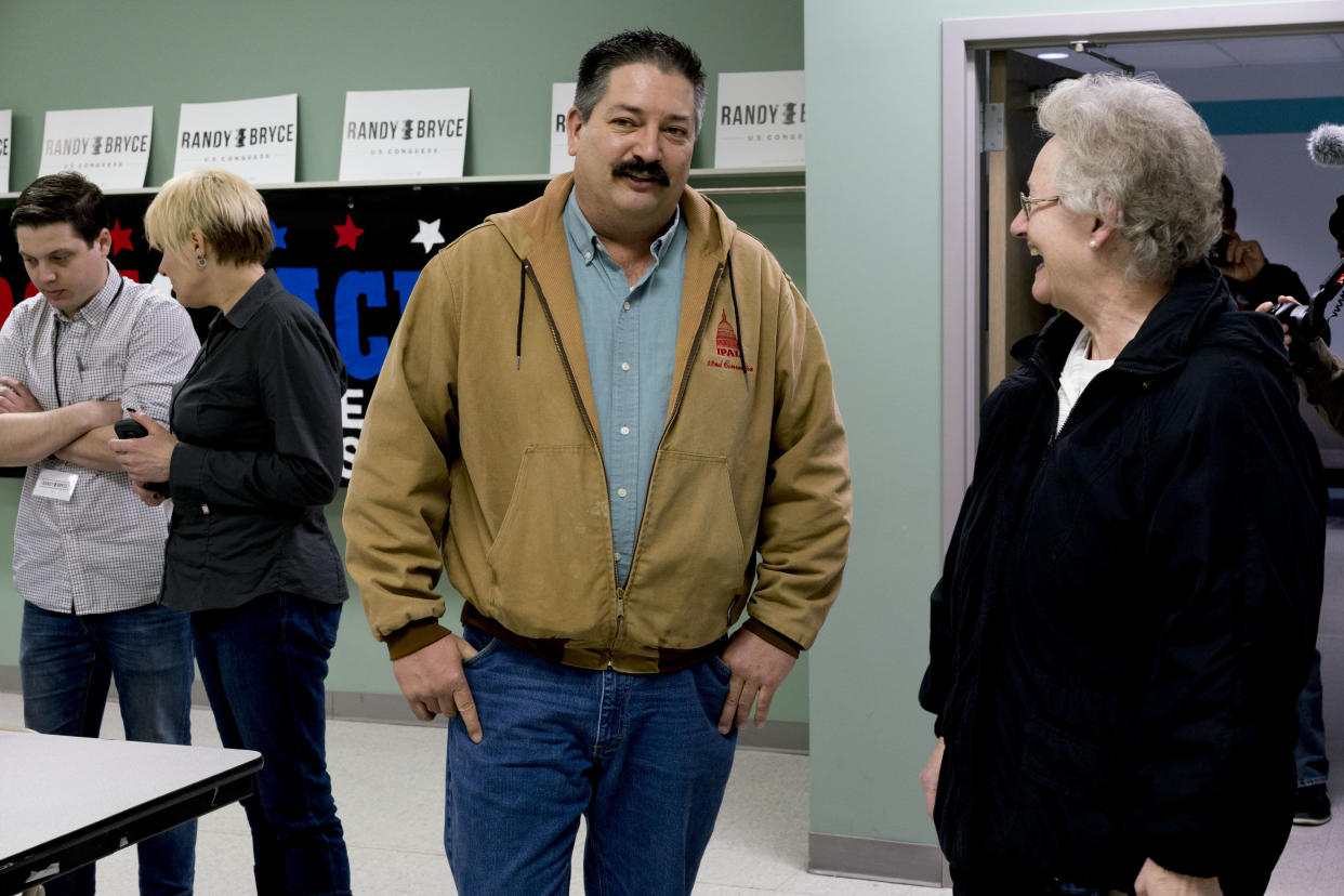 Randy Bryce speaks with a campaign volunteer at an event in Kenosha, Wisconsin, in April. (Photo: Bloomberg/Getty Images)