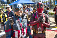 <p>Phuong Nguyen and Derrick Petry, both from Lafayette, La., dressed as Captain America and Deadpool at Comic-Con International on July 19, 2018, in San Diego. (Photo: Richard Vogel/AP) </p>