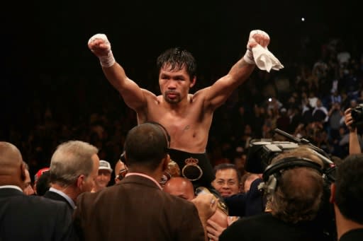 Pacquiao improved to 61-7-2 with 39 knockouts, winning on all three judges scorecards, including by one tally of 117-111