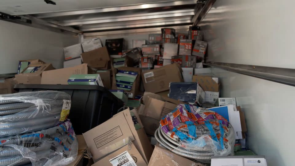 Seized goods fill a Home Depot truck after a law enforcement raid. - CNN