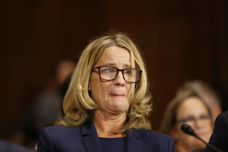 Christine Blasey Ford reacts as she speaks before the Senate Judiciary Committee hearing on the nomination of Brett Kavanaugh to be an associate justice of the Supreme Court of the United States, on Capitol Hill in Washington, DC, U.S., September 27, 2018. Michael Reynolds/Pool via REUTERS