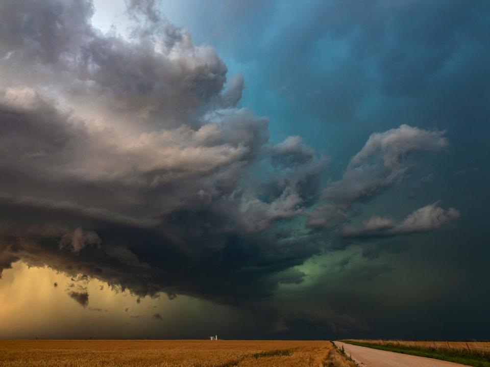 Storm chasers gather to watch this amazing looking severe hail storm works its way across the high plains of Kansas, USA