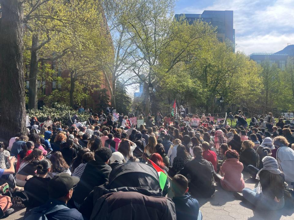 Attendees at a rally organized by NYU students listen to a talk about the history of the Palestinian struggle on April 23, 2024.