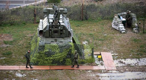 Russian soldiers patrol the air defence missile base stationed near the Olympic park at the Black Sea resort city of Sochi, on November 30, 2013