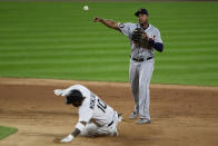 Detroit Tigers' second baseman Jonathan Schoop (8) throws to first base after forcing out Chicago White Sox's Yoan Moncada (10) at second base during the seventh inning of a baseball game Sox Tuesday, Aug. 18, 2020, in Chicago. (AP Photo/Paul Beaty)