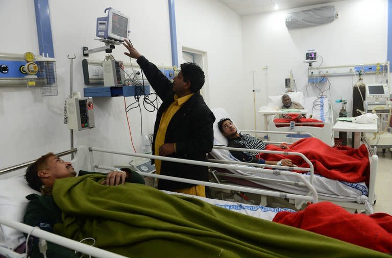 Patients who consumed toxic cough syrup receive treatment in a hospital in Gujranwala on Saturday. At least 24 people, mostly drug addicts seeking a fix, have died after drinking toxic cough syrup in an eastern Pakistani city, officials said on Saturday