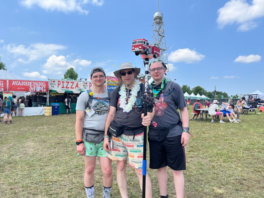 (L-R) Matrix Gwozdz, Daniel Gwozdz and Merlin Gwozdz show off their firefighter-themed totem (Source: WKRN)