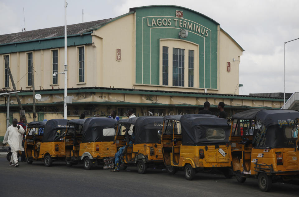 In this Photo taken, Friday, March . 15, 2013, rickshaws are park outside the train station in Lagos, Nigeria. Nigeria reopened its train line to the north Dec. 21, marking the end of a $166 million project to rebuild portions of the abandoned line washed out years earlier. The state-owned China Civil Engineering Construction Corp. rebuilt the southern portion of the line, while a Nigerian company handled the rest. The rebirth of the lines constitutes a major economic relief to the poor who want to travel in a country where most earn less than $1 a day. Airline tickets remain out of the reach of many and journeys over the nation's crumbling road network can be dangerous. The cheapest train ticket available costs only $13. ( AP Photo/Sunday Alamba)