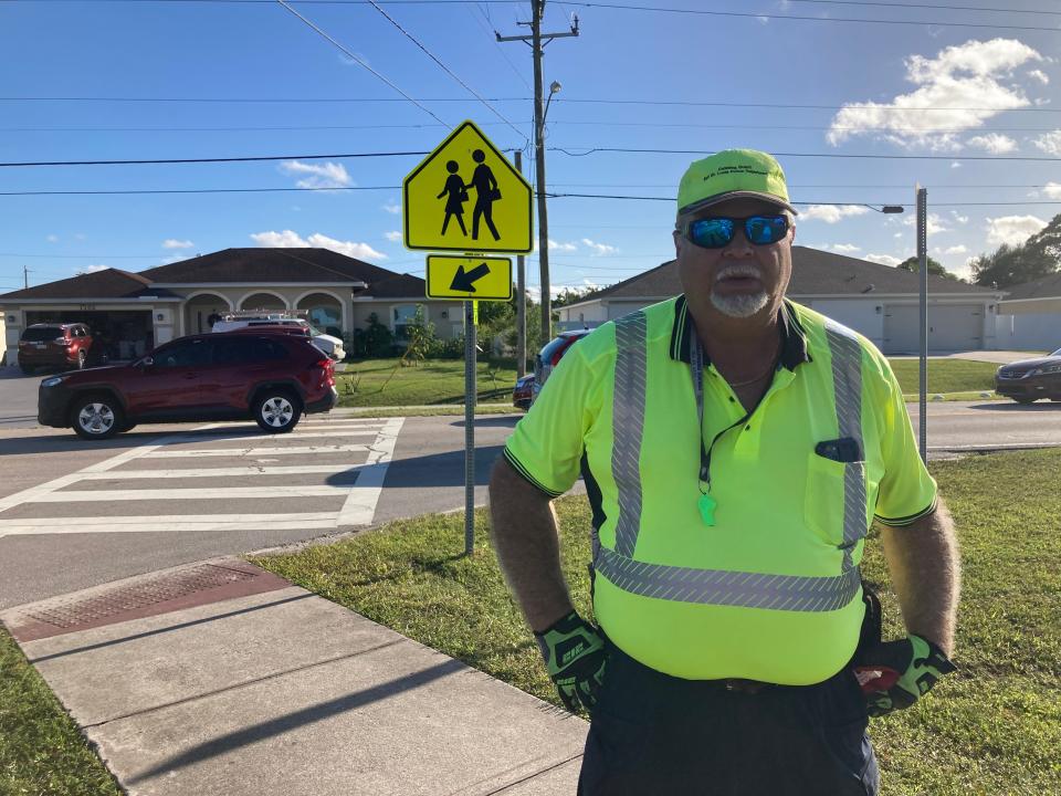 Carlos Rodriguez is a school crossing guard with Port St. Lucie Police. Rodriguez on Nov. 7, 2023, was one of a number of crossing guards working at Oak Hammock K-8 School in Port St. Lucie.