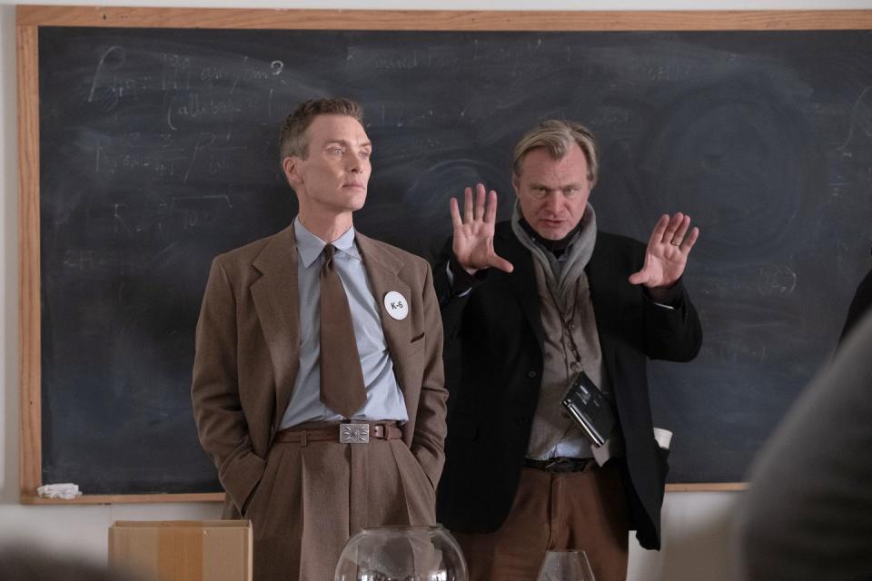 cillian murphy as j robert oppenheimer and writer, director, and producer christopher nolan on the set of oppenheimer