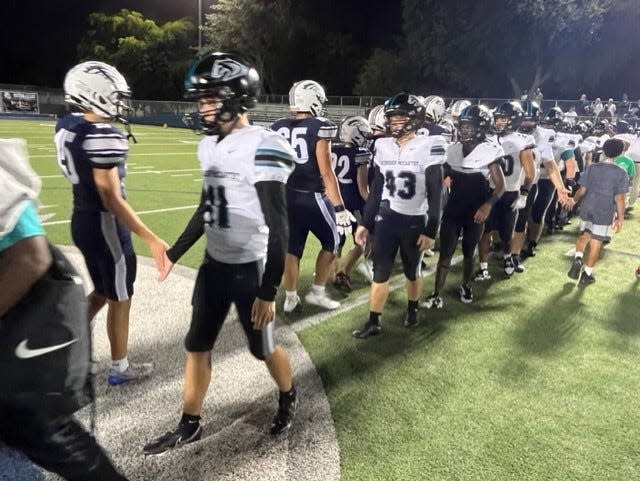 American Heritage-Delray and Archbishop McCarthy football shake hands after a game in Delray Beach on Friday, Sept. 22, 2023.