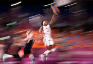 <p>Mamignan Toure of Team France drives to the basket on July 26 in the 3x3 basketball competition at Aomi Urban Sports Park.</p>