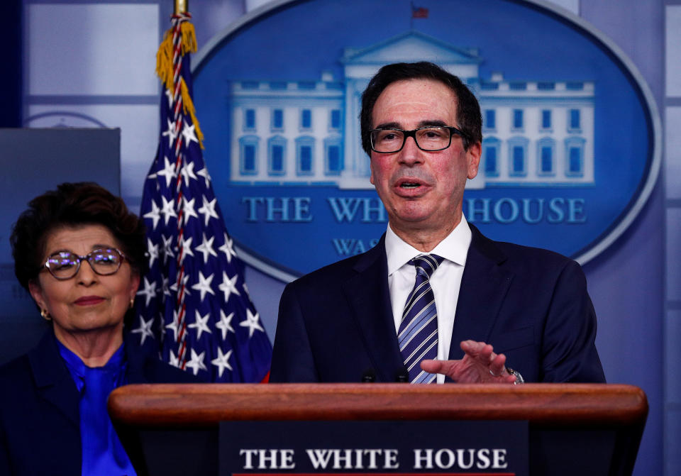 Treasury Secretary Steven Mnuchin discusses details for economic relief during the daily coronavirus response briefing as Small Business (SBA) Administrator Jovita Carranza listens at the White House in Washington, U.S., April 2, 2020. REUTERS/Tom Brenner