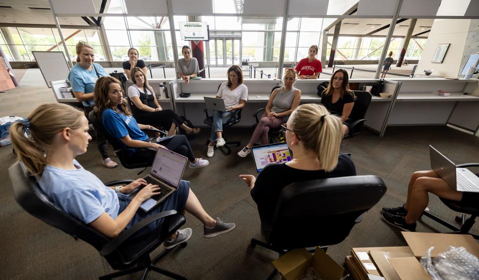 Utah first lady Abby Cox sits down with members of her team to discuss the work of setting up for the Show Up for Teachers event at the Mountain America Exhibition Center in Sandy on Tuesday, July 18, 2023. | Scott G Winterton, Deseret News
