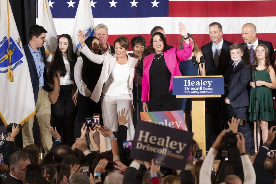 Massachusetts Gov.-elect Maura Healey, center left, and Lt. Gov.-elect Kim Driscoll, center right, stand on stage during a Democratic election night party Tuesday, Nov. 8, 2022, in Boston. (AP Photo/Michael Dwyer)