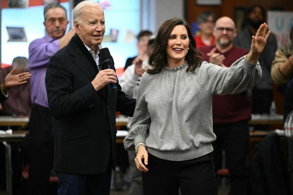 Michigan Governor Gretchen Whitmer waves as US President Joe Biden speaks to members of the United Auto Workers (UAW) at the UAW National Training Center, in Warren, Michigan, on February 1, 2024. US President Joe Biden is in Michigan to attend campaign events. (Photo by Mandel NGAN / AFP) (Photo by MANDEL NGAN/AFP via Getty Images)