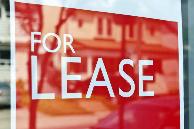 for lease sign on red in window ...