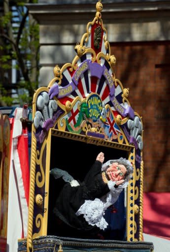 A puppet of Queen Victoria features in a Punch & Judy show during a weekend of performances and shows. Dozens of puppeteers gathered in central London on Sunday to celebrate 350 years of the Punch and Judy show, an anarchic English seaside entertainment known for its slapstick and casual violence