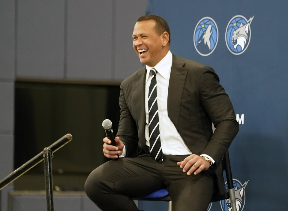 Baseball great Alex Rodriguez laughs during a press conference after Minnesota Timberwolves team owner Glen Taylor introduced Rodriguez and Marc Lore as the new ownership partners of the NBA Timberwolves basketball team, Monday, Sept. 27, 2021, in Minneapolis (AP Photo/Jim Mone)