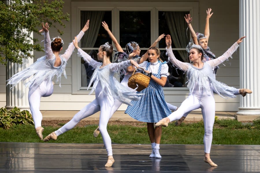 A scene with Dorothy and the tornado in the ballet.