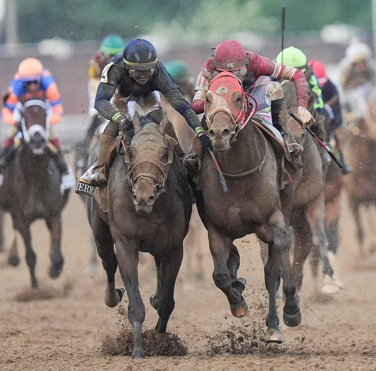 Jockey Tyler Gaffalione, aboard Sierra Leone, engaged Forever Young, with jockey Ryusei Sakai aboard, as the two drove down the stretch during the 150th Kentucky Derby. Mystik Dan won the race by a nose, and Sierra Leone finished second.