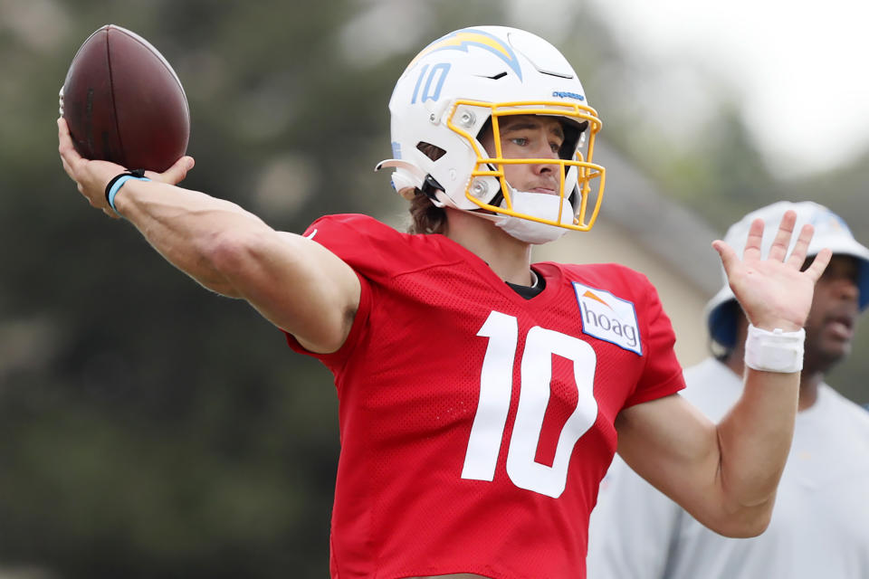 Los Angeles Chargers quarterback Justin Herbert throws a pass during NFL football practice in Costa Mesa, Calif., Friday, Aug. 6, 2021. (AP Photo/Alex Gallardo)