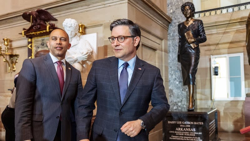 House Minority Leader Hakeem Jeffries, left, and House Speaker Mike Johnson, of Louisiana, attend a statue unveiling ceremony of Daisy Bates, of Arkansas, Wednesday, May 8, 2024, at Statuary Hall on Capitol Hill in Washington. (AP Photo/Jacquelyn Martin)