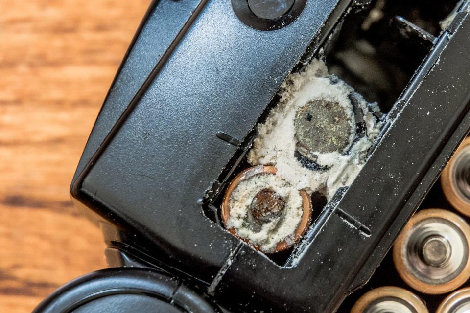 Old, leaking batteries in a television remote. 