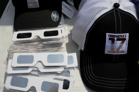 Solar viewing glasses and baseball caps are for sale in Carbondale, Illinois, U.S., August 20, 2017, one day before the total solar eclipse. REUTERS/Brian Snyder