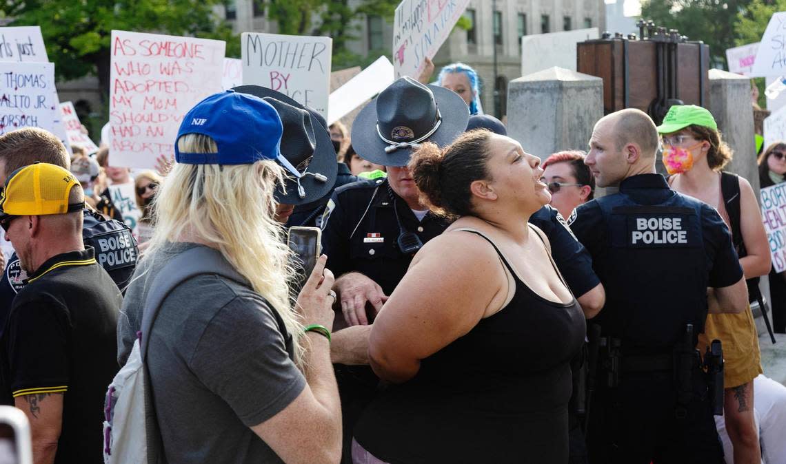 Avalon Hardy, shown with her hands behind her back, said she was with her mother at the time of the arrest.