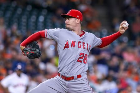 Aug 30, 2018; Houston, TX, USA; Los Angeles Angels starting pitcher Andrew Heaney (28) delivers a pitch during the first inning against the Houston Astros at Minute Maid Park. Mandatory Credit: John Glaser-USA TODAY Sports