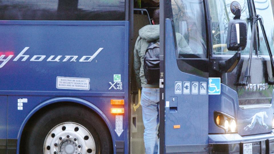 A young man from Uzbekistan boards a Greyhound bus to New York City from the Mountain Mart in Plattsburgh, NY.