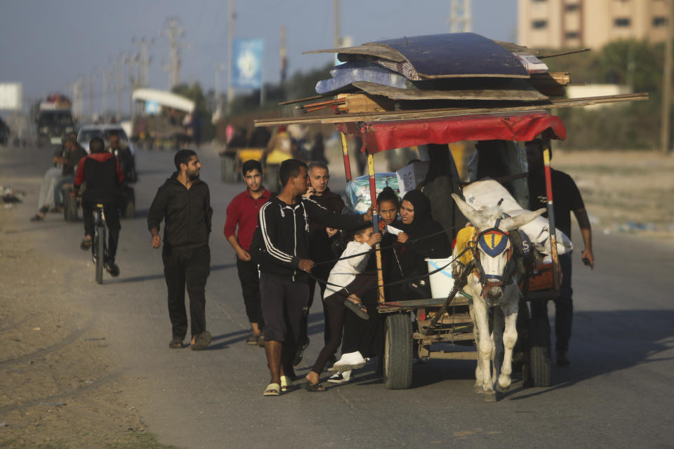 FILE - Palestinians flee the Israeli ground offensive in Khan Younis, Gaza Strip, Wednesday, Dec. 6, 2023. In recent days, Israeli tanks have rumbled into southern Gaza, starting with Khan Younis. It marks a grim new chapter in the war that the Gaza Health Ministry says has already killed over 17,000 Palestinians and the U.N. estimates has displaced 1.9 million people. (AP Photo/Mohammed Dahman, File)