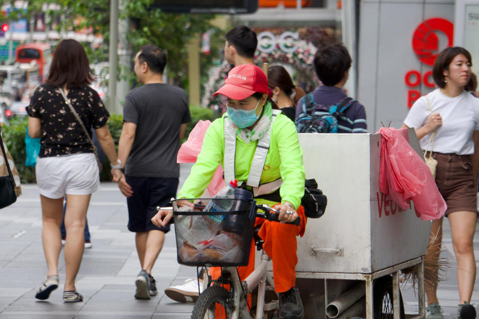 A cleaner seen wearing a face mask along Orchard Road on 9 February 2020. (PHOTO: Dhany Osman / Yahoo News Singapore)