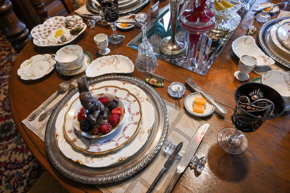 A table setting for Easter is displayed in the dining room of the Meux home and includes special dishes for bread rolls and salt. CRAIG KOHLRUSS/ckohlruss@fresnobee.com