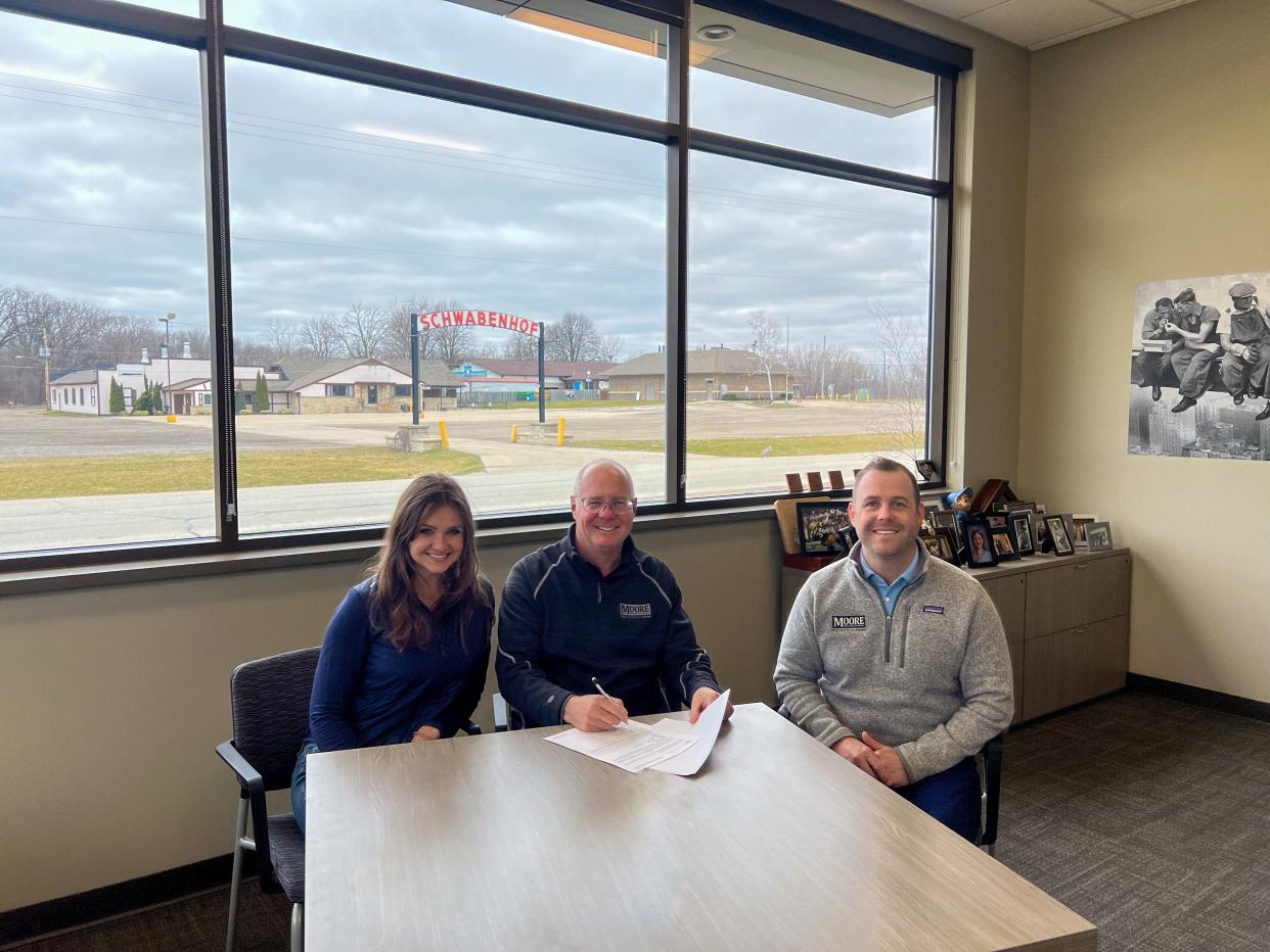 Moore Construction Services expands operations with the acquisition of the former Schwabenhof property in Menomonee Falls. Pictured in the photo is Bridget (Moore) Fritz, left, Mike Moore, center, and Austin Moore, right. The Schwabenhof property, a German-American cultural center, was the site of its Friday Night Fish Fry, German cuisine and cultural activities.