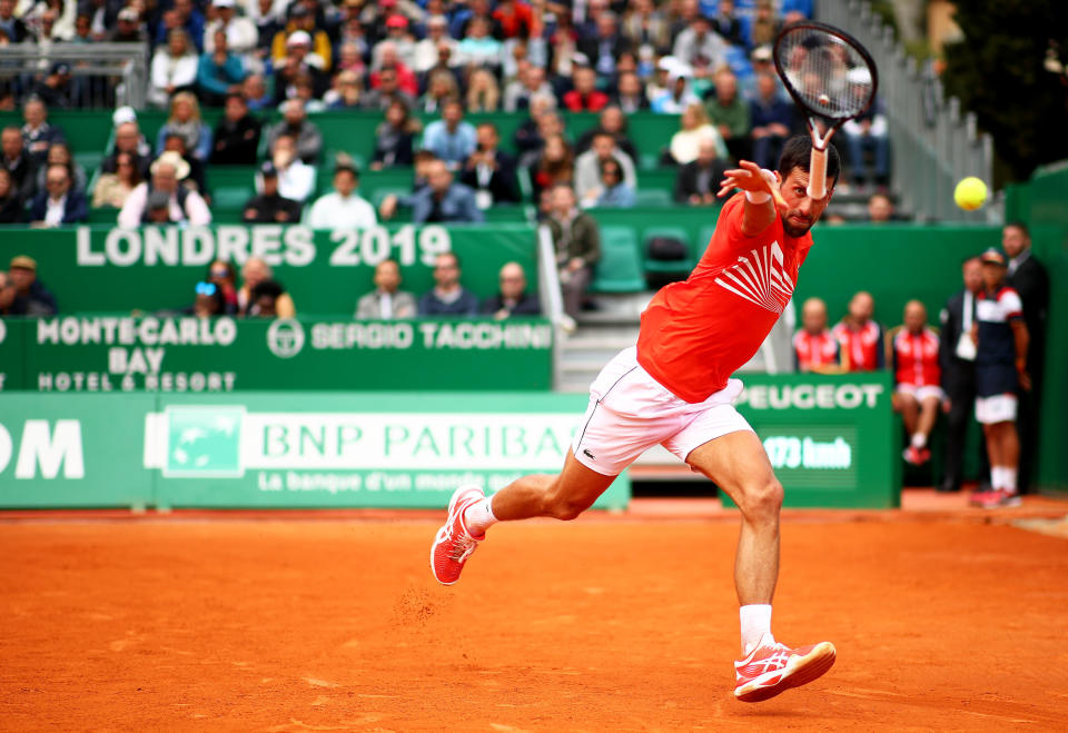 MONTE-CARLO, MONACO - APRIL 16: Novak Djokovic of Serbia throws his racket at the ball after trying to play a backhand against Philipp Kohlschreiber of Germany in their second round match during day 3 of the Rolex Monte-Carlo Masters at Monte-Carlo Country Club on April 16, 2019 in Monte-Carlo, Monaco. (Photo by Clive Brunskill/Getty Images)