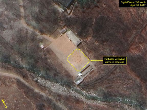 <p>North Korea's military has been spotted seemingly playing a game of volleyball at the main Punggye-ri nuclear test site.</p> <p>Satellite images of the site appear to show two six-player teams facing each other, with a net between them.</p> <p>Joseph Bermudez, an analyst for non-profit <a rel="nofollow noopener" href="http://38north.org/2017/04/punggye041917/" target="_blank" data-ylk="slk:38 North;elm:context_link;itc:0;sec:content-canvas" class="link ">38 North</a>, which first noticed the pictures, said multiple games were going on at the facility — at the administrative area, the support area, the command centre, and at the guard barracks.</p>  <p>A possible volleyball net seen in the command center area</p><div><p>Image: DigitalGlobe/Getty Images</p></div> <p>A probable volleyball game seen at the guard barracks at Punggye-ri</p><div><p>Image: DigitalGlobe/Getty Images</p></div><p>The people appear to be standing in formations consistent with volleyball games, he added.</p> <p>But if you thought the North Koreans were taking a break, it's more likely that the games were staged knowing the outside world is looking.</p>  <p>PUNGGYE-RI NUCLEAR TEST SITE, NORTH KOREA - APRIL 16, 2017. Figure 4. Probable volleyball game seen at the command center support area. (Photo DigitalGlobe/38 North via Getty Images)</p><div><p>Image: DigitalGlobe/Getty Images</p></div><p>Analysts <a rel="nofollow noopener" href="https://www.nytimes.com/2017/04/19/world/asia/north-korea-nuclear-test-volleyball.html" target="_blank" data-ylk="slk:told the New York Times;elm:context_link;itc:0;sec:content-canvas" class="link ">told the <em>New York Times</em></a> that the games were probably intended to send a message, as North Korea knows that the Punggye-ri test site is under intense scrutiny.</p> <p>The games could be North Korea's way of indicating that it's pausing its controversial nuclear missile testing activity — or that it's making it seem like it has.</p> <p>Both <a rel="nofollow noopener" href="http://www.fmprc.gov.cn/mfa_eng/xwfw_665399/s2510_665401/2511_665403/t1454907.shtml" target="_blank" data-ylk="slk:China;elm:context_link;itc:0;sec:content-canvas" class="link ">China</a> and <a rel="nofollow noopener" href="https://www.washingtonpost.com/world/asia_pacific/pence-makes-surprise-stop-to-demilitarized-zone-during-korea-trip/2017/04/16/e1da822e-230e-11e7-a1b3-faff0034e2de_story.html?tid=ptv_rellink&utm_term=.fb6a67e47a51" target="_blank" data-ylk="slk:the U.S.;elm:context_link;itc:0;sec:content-canvas" class="link ">the U.S.</a> have raised condemnation of the hermit country's nuclear tests in recent weeks, as Trump places pressure on the North to halt its missile activity.</p> <p>"While strongly suggestive of the completion of preparations for a sixth nuclear test, the imagery alone does not provide any definitive evidence of the installation of a nuclear device or indication of the specific timing for such an event," Bermudez told <em>Mashable</em>.</p> <p>Volleyball games are a normal occurrence at Punggye-ri, according to Melissa Hanham, an analyst at the Middlebury Institute of International Studies in Monterey, California. The game is a popular sport in North Korea. </p> <p>"It doesn't mean anything other than people are there and [that] they are bored," Hanham said in an email to <em>Mashable. </em></p> <p>Both Hanham and Bermudez agreed that the site could still be ready for a nuclear test. </p> <p>38 North described the site as "primed and ready" <a rel="nofollow noopener" href="http://38north.org/2017/04/punggyeri041217/" target="_blank" data-ylk="slk:on April 12;elm:context_link;itc:0;sec:content-canvas" class="link ">on April 12</a>, and a UN representative of the reclusive dictatorship confirmed that a new nuclear test was <a rel="nofollow noopener" href="http://www.channelnewsasia.com/news/asiapacific/north-korea-says-ready-to-react-to-any-mode-of-war-from-us/3685330.html" target="_blank" data-ylk="slk:under preparation;elm:context_link;itc:0;sec:content-canvas" class="link ">under preparation</a>. </p> <p><a rel="nofollow noopener" href="http://www.channelnewsasia.com/news/asiapacific/tensions-high-north-korea-readies-nuclear-test-report/3674450.html" target="_blank" data-ylk="slk:Analysts speculated;elm:context_link;itc:0;sec:content-canvas" class="link ">Analysts speculated</a> that the reclusive dictatorship could trigger a nuclear test to mark the 105th birth anniversary of the country's founding leader, Kim Il-Sung, which occurred last Saturday. Kim Il-Sung's grandson, Kim Jong-un, is North Korea's current leader.</p> <p>"The ultimate choice as to whether to test, or not to test, rests solely in the hands of Kim Jong-un," Bermudez said.</p> <div> <h2>WATCH: Scientists discovered a rare giant black worm monster in the Philippines</h2>  </div>