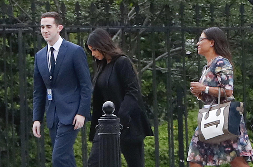 Kim Kardashian, center, arrives at the security entrance of the White House on May 30, 2018. (AP Photo/Pablo Martinez Monsivais)