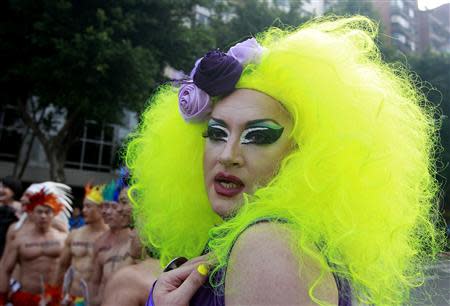 A man dressed in drag parades during the Taiwan LGBT Pride Parade in Taipei October 26, 2013. REUTERS/Pichi Chuang