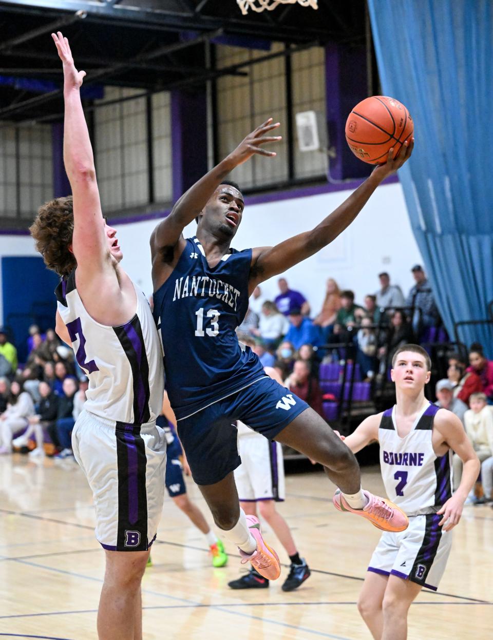 BOURNE 01/12/24 Jayquan Francis of Nantucket drives to the hoop past Nate Reynolds of Bourne. boys basketball
Ron Schloerb/Cape Cod Times