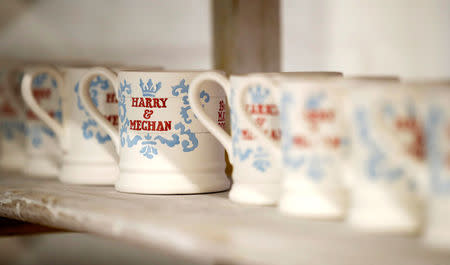 Mugs commemorating the wedding of Britain's Prince Harry and Meghan Markle wait to be glazed at the Emma Bridgewater Factory, in Hanley, Stoke-on-Trent, Britain March 28, 2018. REUTERS/Carl Recine