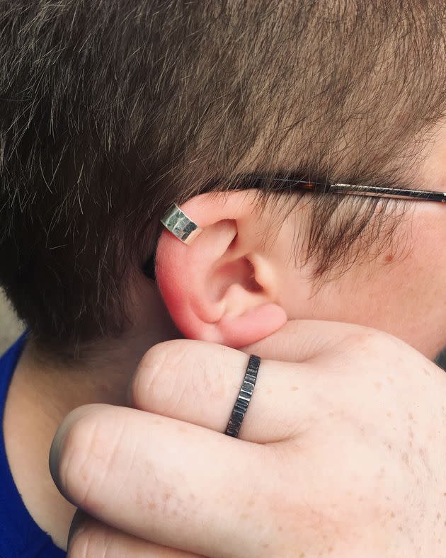 A photo of my girlfriend's hand with the ring I gave them on it, and my ear with the ring – well, ear cuff – they gave me. At the time I didn't want a ring as I was sure I would lose it.