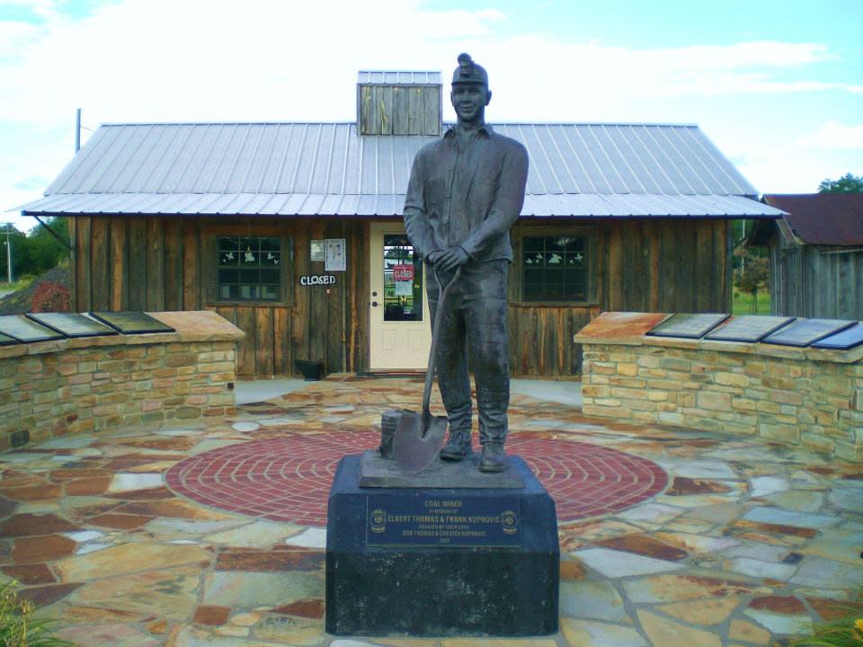 A statue of a miner stands outside the Paris-Logan County Coal Miners Memorial and Museum.