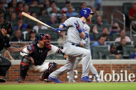 May 15, 2018; Atlanta, GA, USA; Chicago Cubs left fielder Ben Zobrist (18) hits an RBI single scoring shortstop Addison Russell (not pictured) in the ninth inning against the Atlanta Braves at SunTrust Park. Mandatory Credit: Jason Getz-USA TODAY Sports