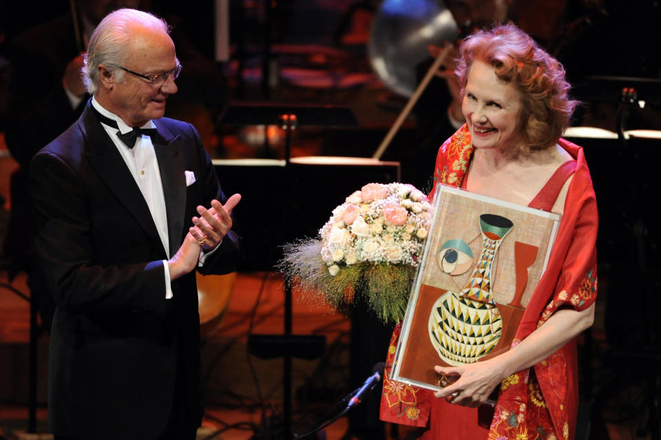 Polar Music Prize laureate composer Kaija Saariaho, of Finland, receives the Polar Music Prize 2013 from King Carl Gustaf, left, at the prize-ceremony in Stockholm Concert Hall in Stockholm, on Aug. 27, 2013. Saariaho, who wrote acclaimed works that made her the among the most prominent composers of the 21st century, died Friday, June 2, 2023, at her apartment in Paris, her family said in a statement posted on her Facebook page. She was 70. Saariaho had been diagnosed in February 2021 with glioblastoma, an aggressive and incurable brain tumor. (Erik Martensson/TT News Agency via AP, File)
