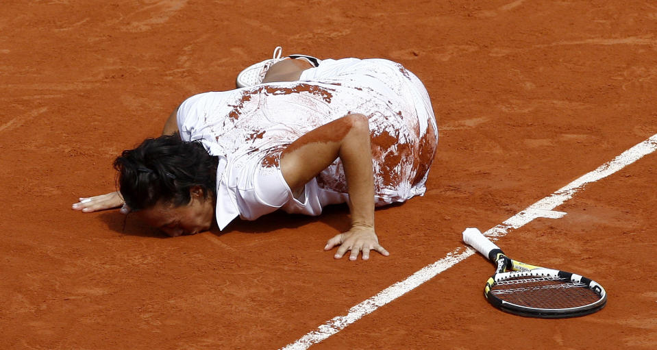 FILE - In this June 5, 2010, file photo, Italy's Francesca Schiavone kisses the court after defeating Australia's Samantha Stosur during a women's final match at the French Open tennis tournament at Roland Garros stadium in Paris. (AP Photo/Michel Spingler, File)